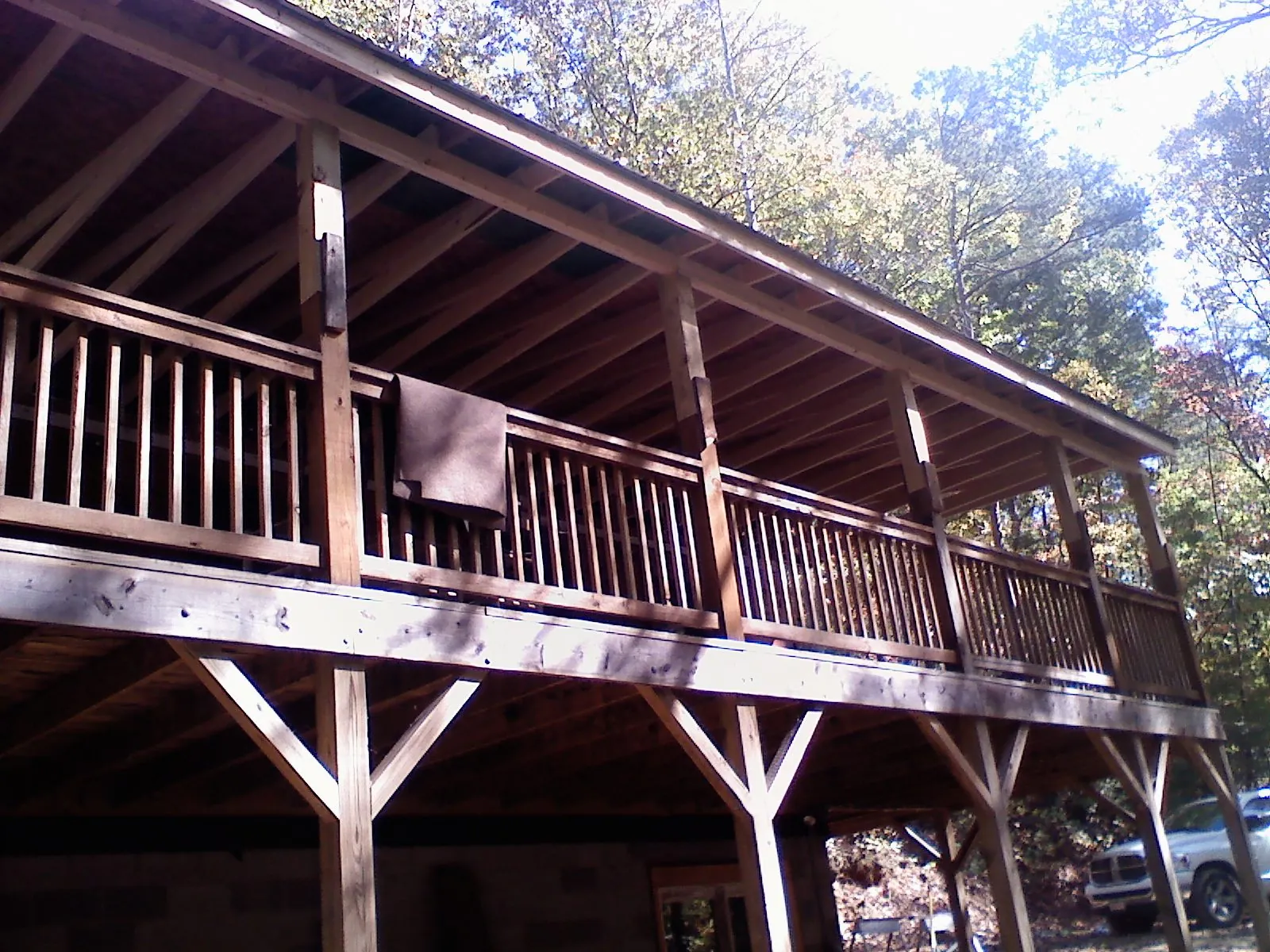 Timber framing under a new elevated porch and deck — Roof Leak Repair in Olivet by Roofing Brothers